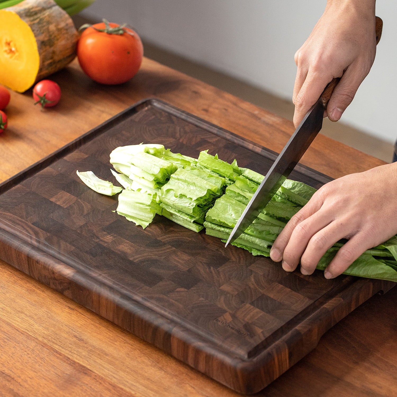 Muso Wood Walnut Wood Checkered Cutting Board with Feet 16 X 12 In